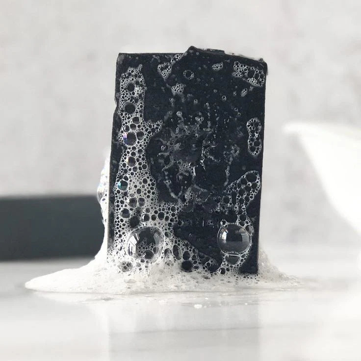 Black soap bar with bubbles