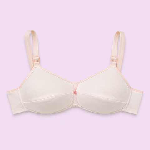 Beige bra on a light purple background