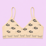 Beige bra with black butterfly patterns 