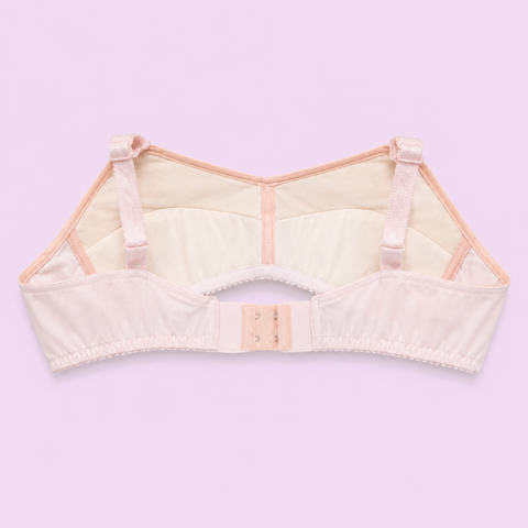 Beige bra on a light purple background